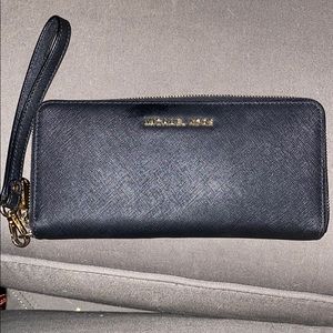 Michael Kors black wallet.